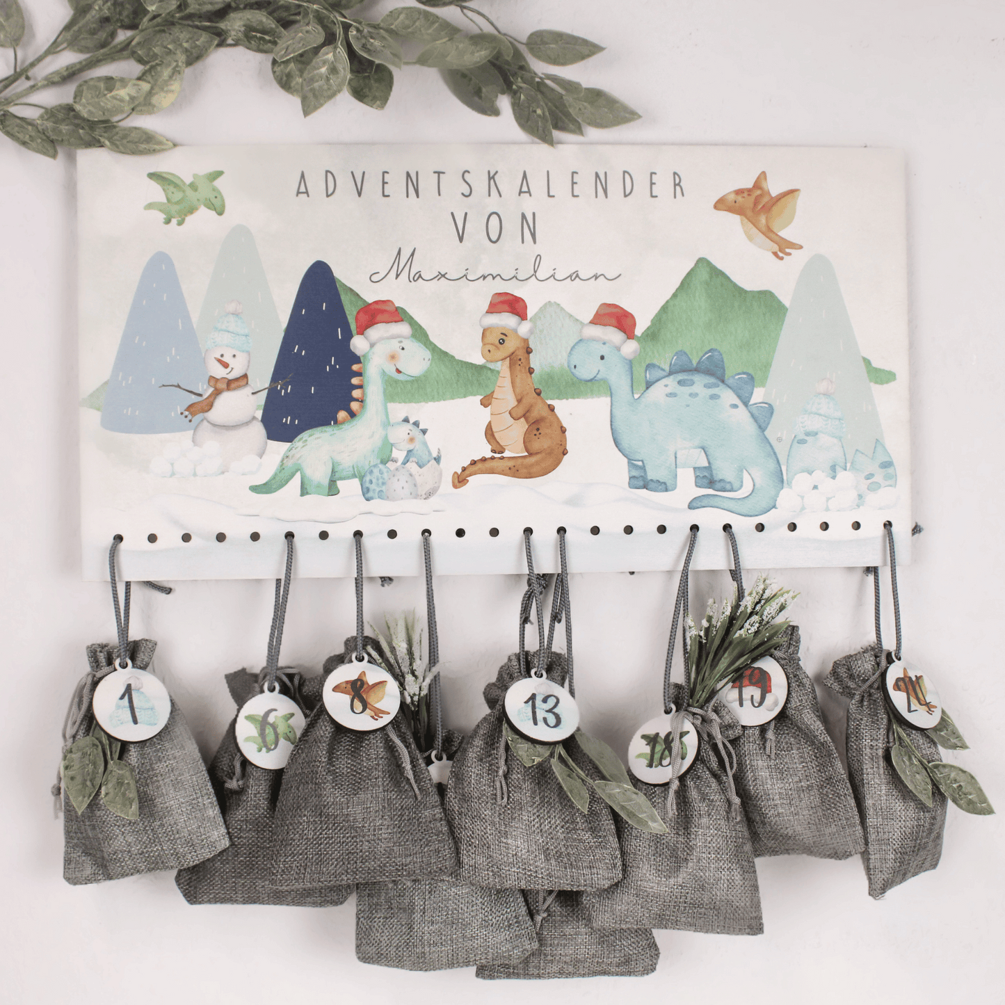 Adventskalender mit Wunschnamen - Schnee Dinos weihnachtlich